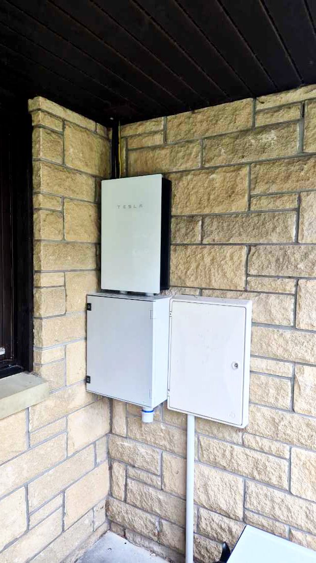 Tesla Powerwall installed on wall