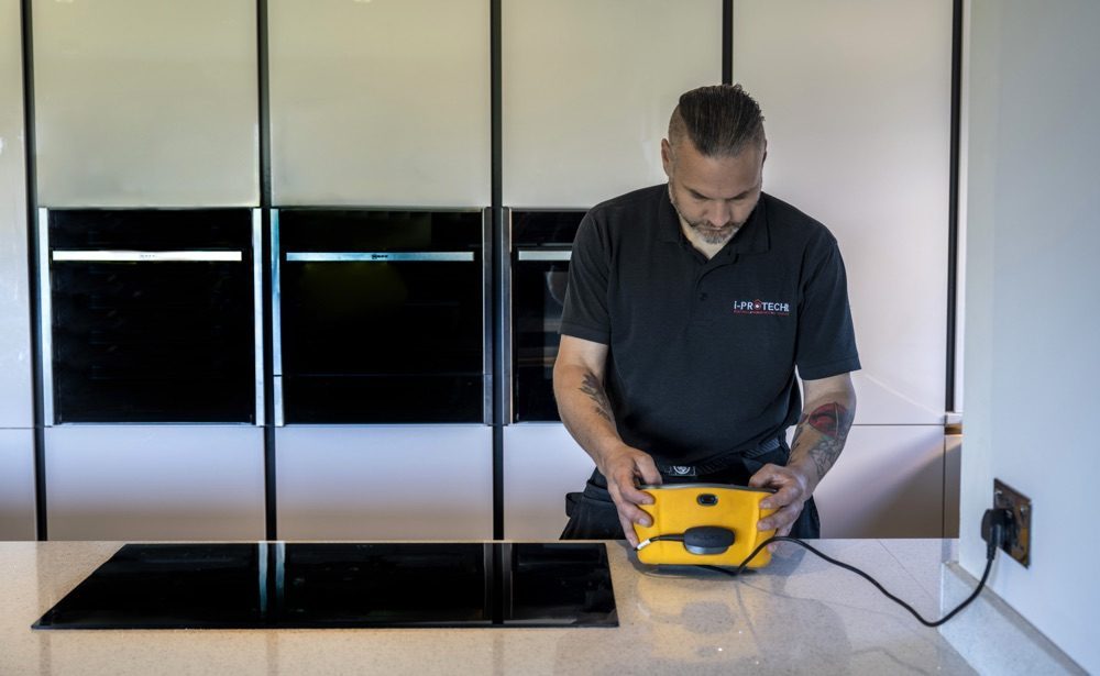 man checking electrical item