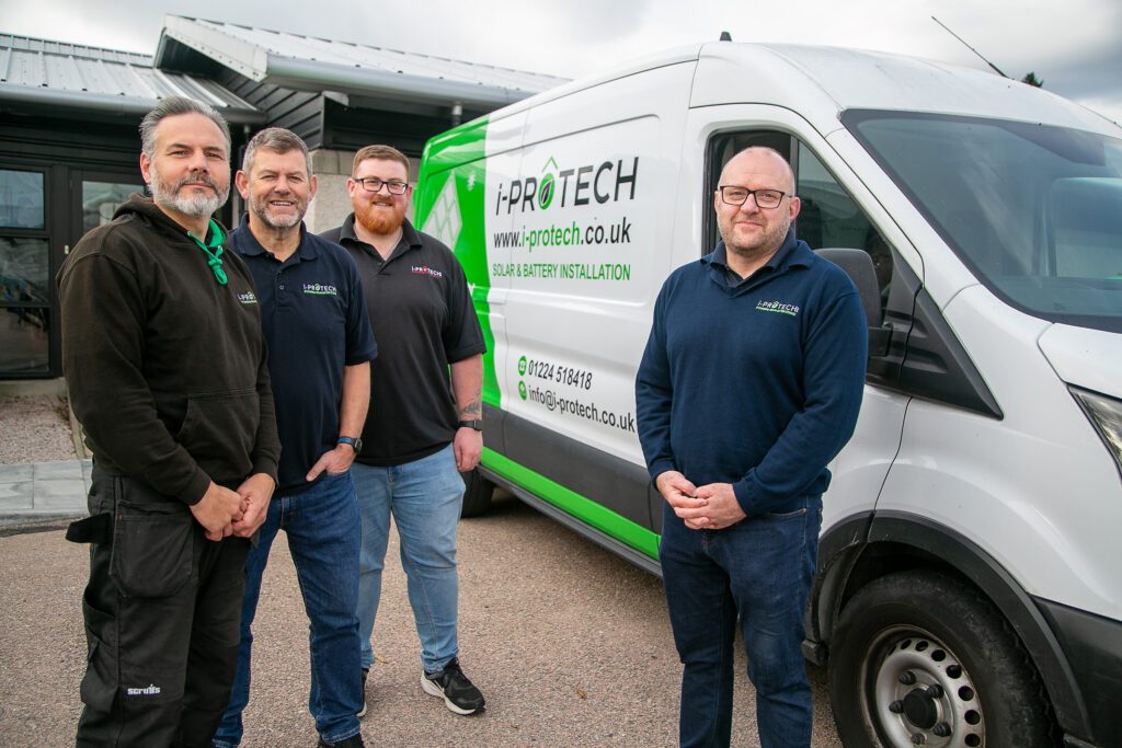 i-Protech core team members in front of a van